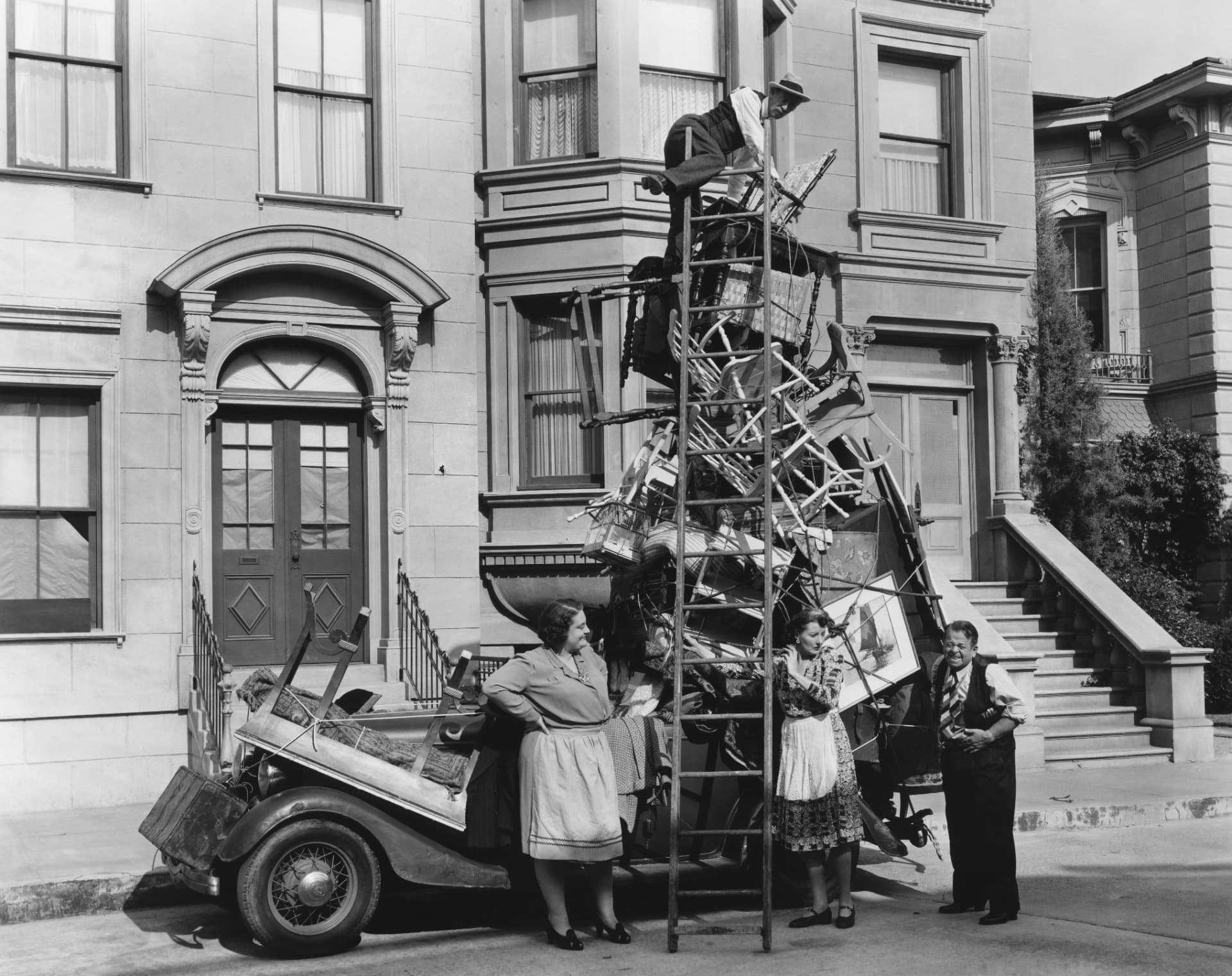 A property team beside an overloaded vehicle